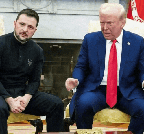two men are sitting next to each other and one of them is wearing a shirt that says ' ukraine ' on it