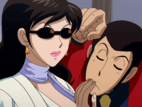 a man and a woman are standing next to each other and the woman is wearing sunglasses