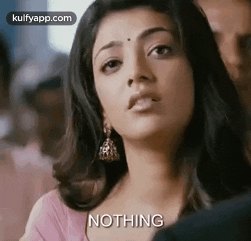 a close up of a woman 's face with the words `` nothing '' written next to her .