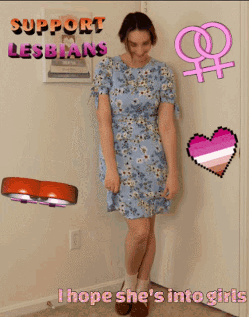 a woman in a blue dress is standing in front of a door with the words " support lesbians " written on it
