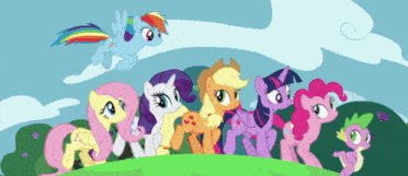 a group of ponies are standing on a grassy hillside