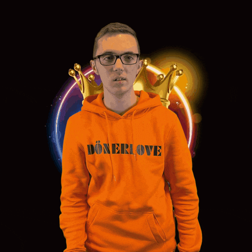 a man in an orange hoodie holding a sandwich with the letter b on it