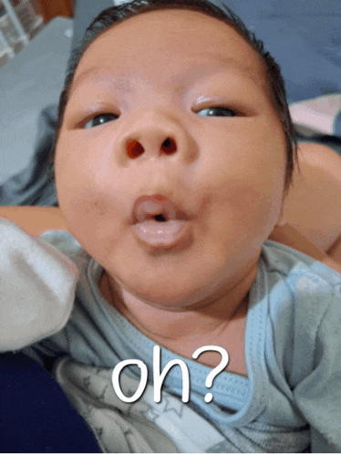 a baby is making a funny face with the words oh written on the bottom