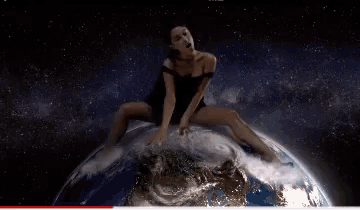 a person is touching the earth with their finger .