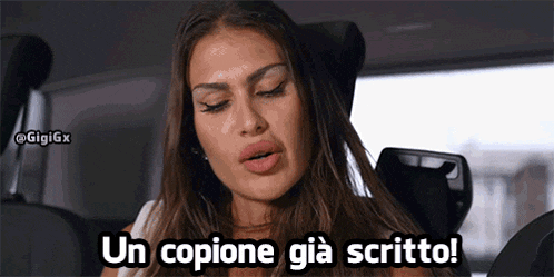 a woman is sitting in a car and says un copione già scritto