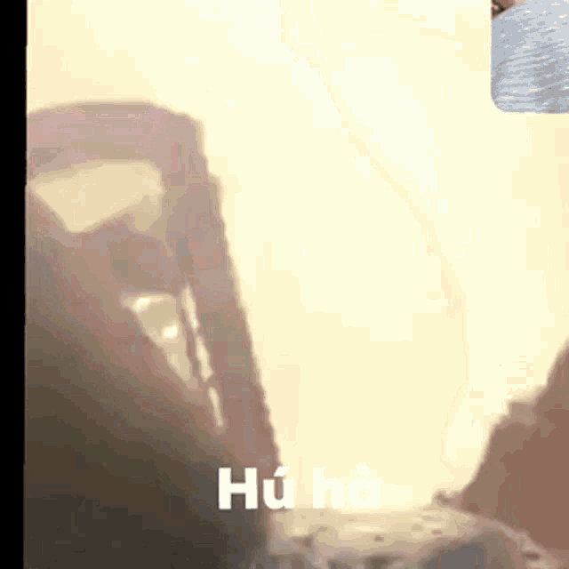 a blurred image of a person with hu ha written on it