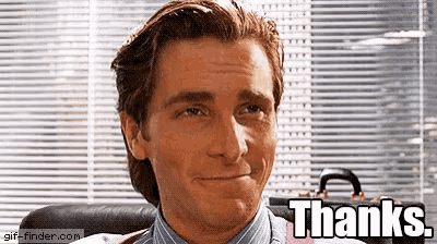 a man in a suit and tie is smiling with the words thanks above him
