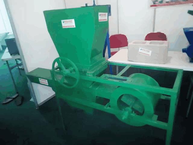 a green machine has a label on it that says ' agricultural machinery '