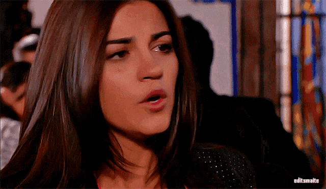 a close up of a woman 's face with the word edit on the bottom right corner