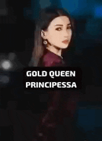 a woman in a red shirt is standing in front of a sign that says gold queen principessa .