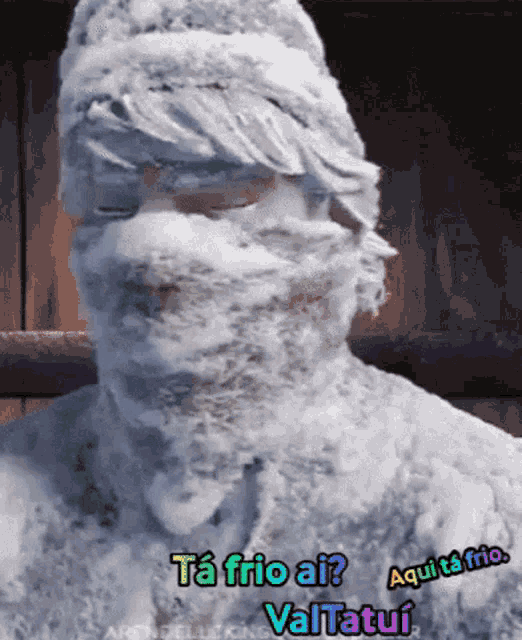 a man covered in snow with the words ta frio ai written on the bottom