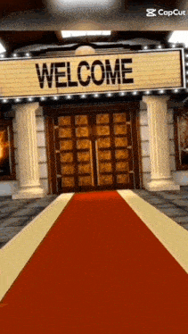 a red carpet leads to a welcome sign