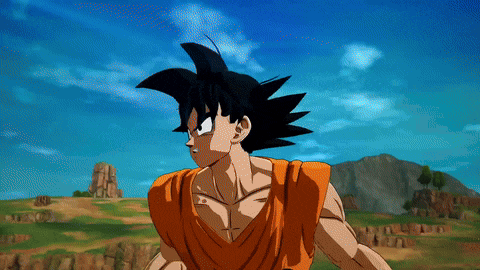 a cartoon character named goku stands in a field with mountains in the background