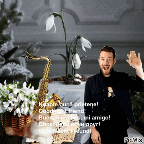 a man standing next to a saxophone and flowers with a picmix watermark