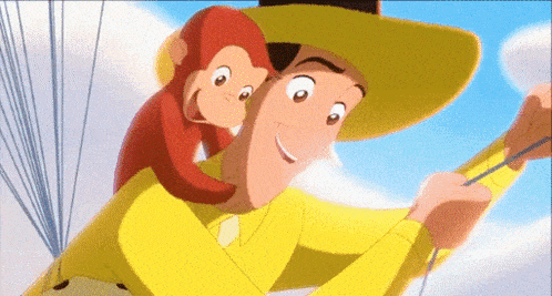 a man in a yellow shirt is holding a monkey on his shoulders