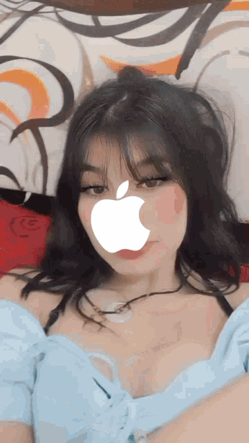 a girl with an apple on her face