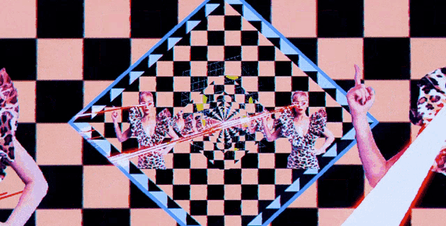a woman is standing in front of a checkered background