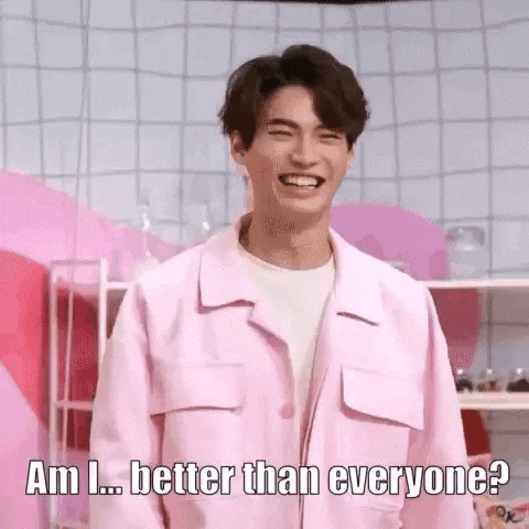 a man in a pink jacket is laughing and asking if he is better than everyone .