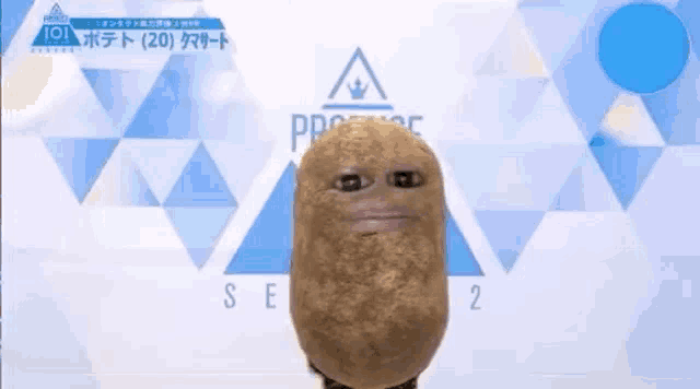 a potato with a human face is standing in front of a blue background .