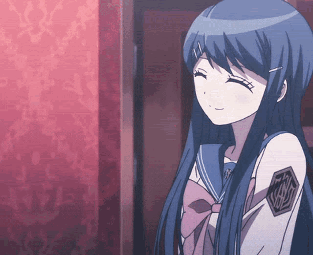 a girl with long blue hair has a badge on her arm that says ' tokyo ghoul '