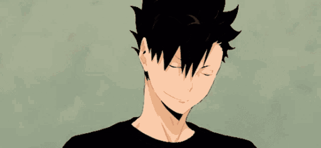 a close up of a person 's face with their eyes closed and a black shirt on .