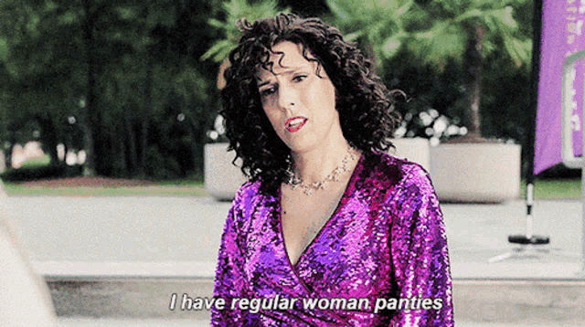 a woman in a purple sequined top says i have regular woman panties