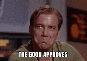 a man in a green shirt is making a face and saying `` the goon approves '' .