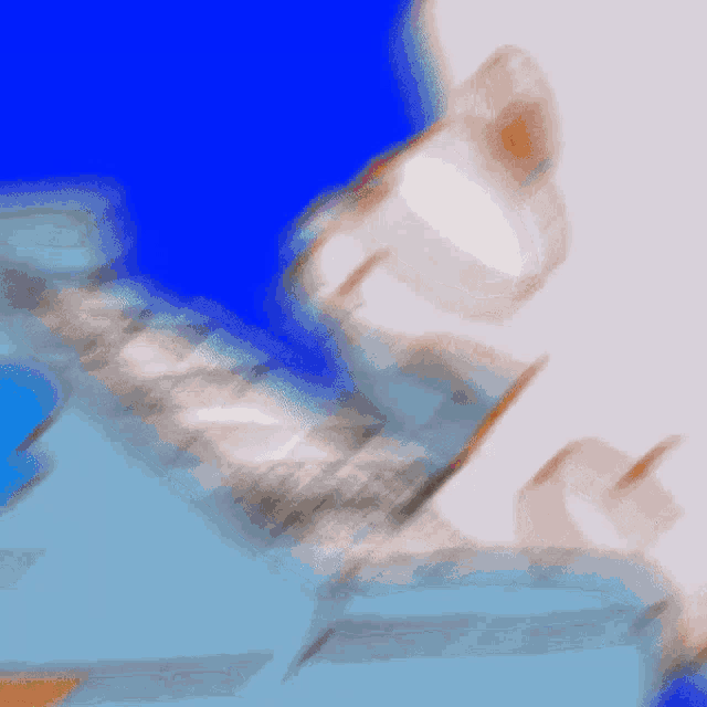a blurry picture of a blue background with a white object in the foreground