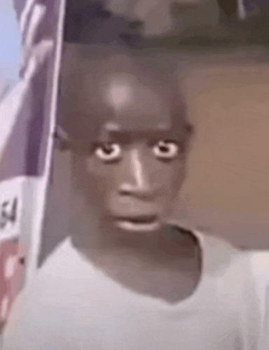 a close up of a person making a funny face with their mouth open .