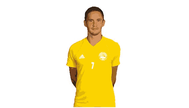 a man wearing a yellow adidas shirt with the number 7 on it