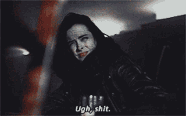a woman says ugh shit in a dark room