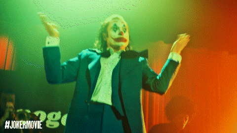 a poster for the joker movie shows a man in a tuxedo