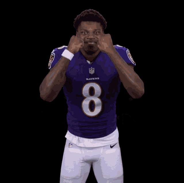 a man in a purple ravens jersey with the number 8 on it