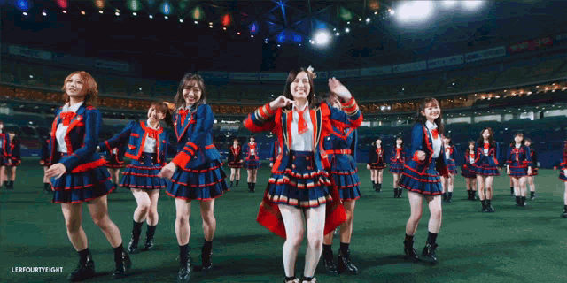 a group of girls are dancing in a stadium with a caption that says lerfourthright