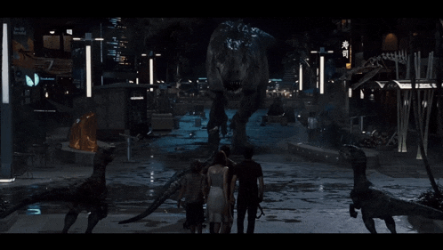 a group of people are standing in front of a t-rex statue
