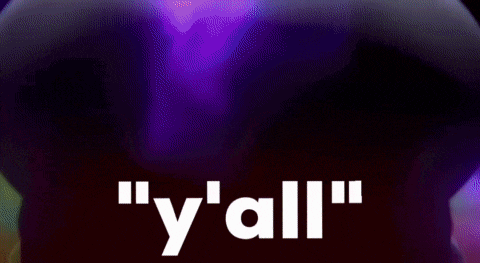 a close up of a troll with red eyes and the words `` y 'all '' written in white .
