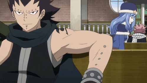 a man with a tattoo on his arm is standing in front of a woman