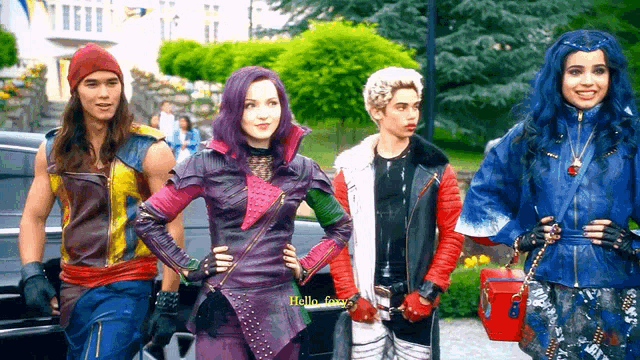 a group of descendants characters are standing next to each other and one of them says hello
