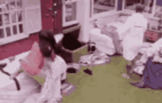a group of people are sitting in a living room .