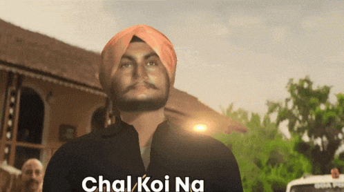 a man in a turban is standing in front of a building with the words chal koi na written on the bottom