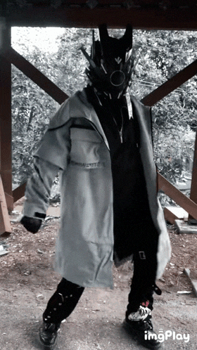 a person wearing a mask and a jacket that says ' imgplay ' on it
