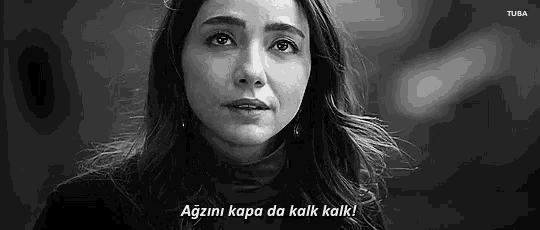 a black and white photo of a woman with the words `` agzini kapa da kalk kalk ! ''