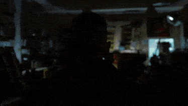 a man is looking out a window at a bus that says ' first ' on the side