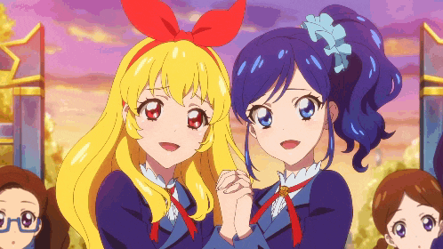 two anime girls are standing next to each other