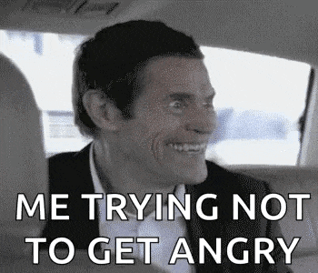 a man in a suit is sitting in the back seat of a car .