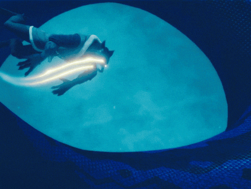 a person is swimming in a blue pool with a light coming out of their back