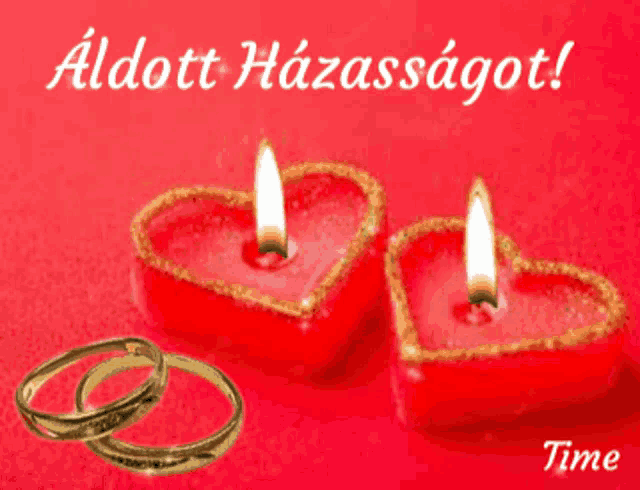 a greeting card with two candles in the shape of hearts and a wedding ring