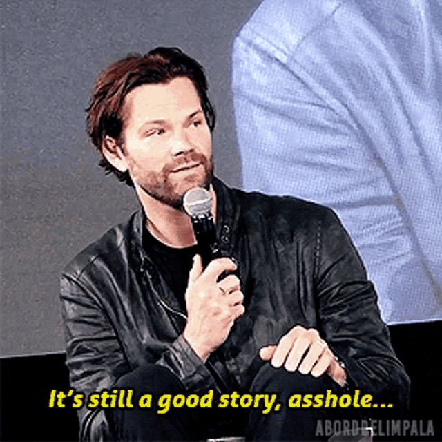 a man speaking into a microphone with the words it 's still a good story asshole