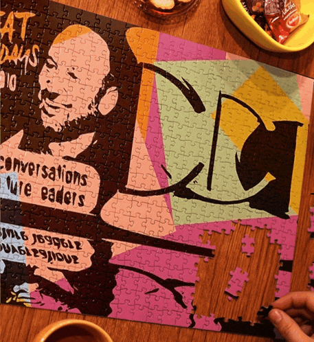 a puzzle that says " conversations with eaders " is being completed