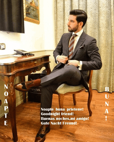 a man in a suit and tie is sitting in a chair